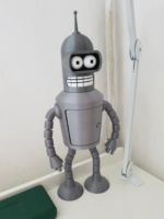 a toy robot (Bender) standing on a table