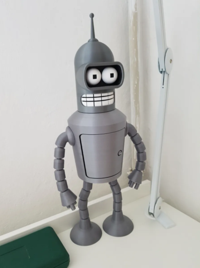 a toy robot (Bender) standing on a table