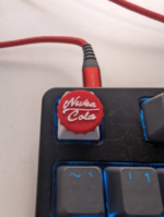 3D Printed Nuka Cola Keycap - Unique and Stylish