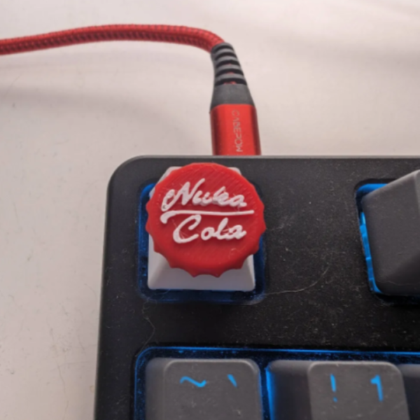 3D Printed Nuka Cola Keycap - Unique and Stylish